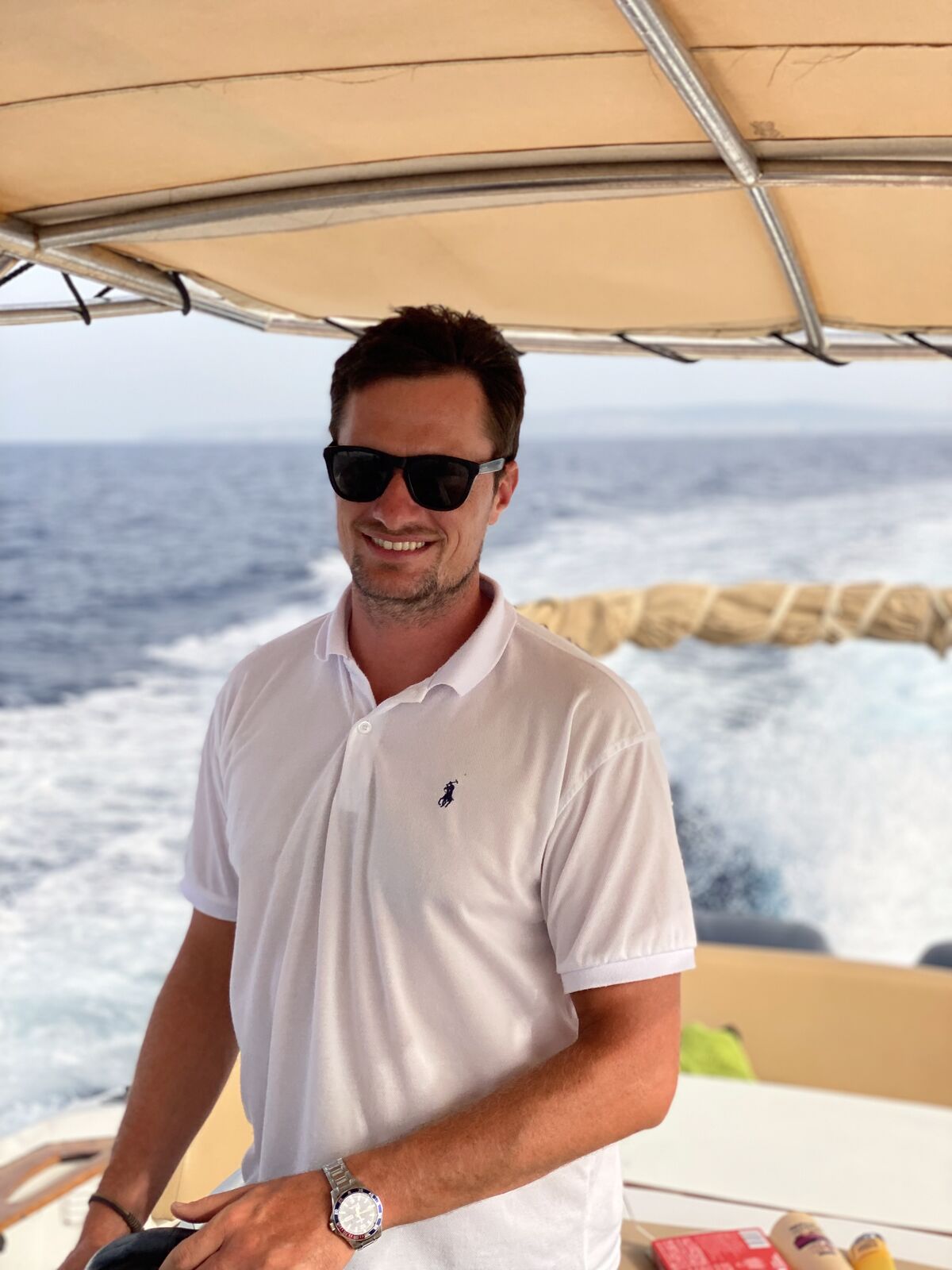 Alin Letca, founder of Just Enjoy Ibiza Boats, on a yacht in the Mediterranean